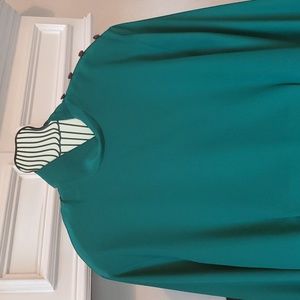Ladies emerald green silk looking polyester long-sleeved shirt.